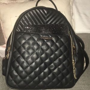 Aldo Black Backpack with sparkly clutch included.